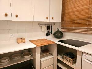 A kitchen or kitchenette at El ático de Concha