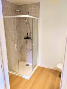 a shower with a glass door in a bathroom at Chez Clo & Tonio in Saint-Hélen +22 photos
