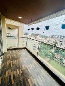 a room with a large window with a view of a city at kolte patil 24k allura in Pune