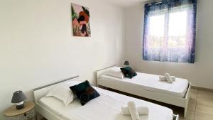 Letto o letti in una camera di Ti Bonheur