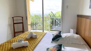Postel nebo postele na pokoji v ubytování Ti Plage, Superbe villa mitoyenne T4 avec sublime vue mer