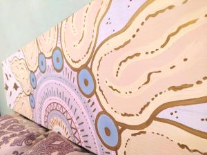a close up of a painting on a wall at Casa Candelita in Valladolid