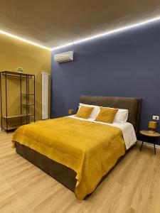Ένα ή περισσότερα κρεβάτια σε δωμάτιο στο Vomero Suite b&b Napoli