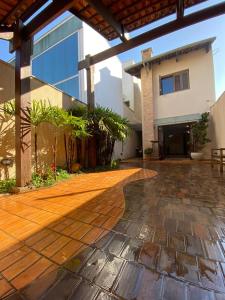 a patio of a house with a building at Lulle Hostel - Congonhas - Expo - Interlagos - Morumbi in São Paulo +22 photos