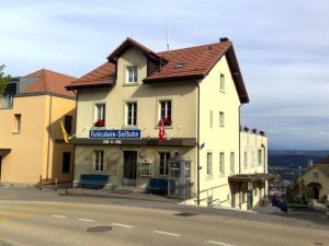 a building on the side of a street at Garden room - view of nature in Evilard