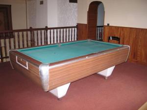 a pool table in the middle of a room at Charme en Champagne in Trémilly