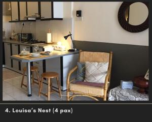 a kitchen with a table and a chair and a desk at ThatNicePlace, Selesa Hillhomes, Bukit Tinggi, Janda Baik, Genting in Bentong