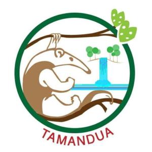 un logotipo para una empresa con un bebé y una cruz en Complejo Ecoturistico Tamandua, en Drake