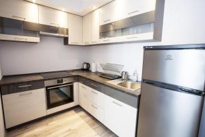 Kuchyňa alebo kuchynka v ubytovaní BTS Apartaments - Apartamenty Blisko Morza