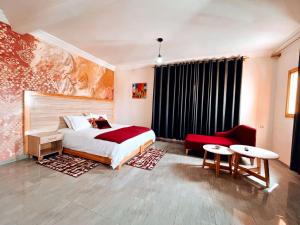 Giường trong phòng chung tại Hotel Fyndy Dakhla