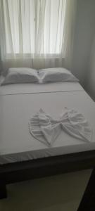 Postel nebo postele na pokoji v ubytování Hotel Apartado Real