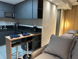 Η κουζίνα ή μικρή κουζίνα στο Apartamento 53 - Studio Aconchegante e Completo +3 φωτογραφίες