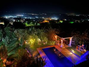 a house with a swimming pool at night at Villa Begdour à 30Mints de Tanger in Tangier
