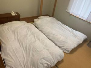 Postel nebo postele na pokoji v ubytování ステイビレッジ蔵王1棟貸し2名様まで同一金額ペット同伴可別途有償