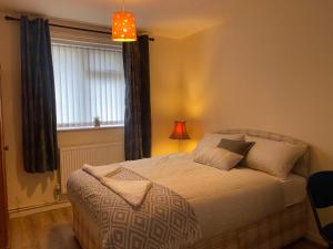 Ліжко або ліжка в номері PnG Suites - Abernant Rooms Shared Facilities