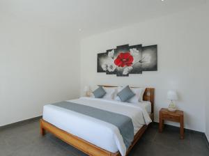 Postel nebo postele na pokoji v ubytování Villa Gajah By Hospitality Bali