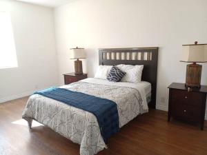 a bedroom with a large bed with two night stands at Newstar Castle in Lancaster