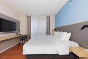 Postel nebo postele na pokoji v ubytování Holiday Inn Express Beijing Yizhuang Tongming Lake By IHG