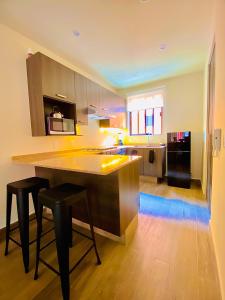 a kitchen with a large island in the middle of a room at TriBeCa San Miguel in San Miguel de Allende +4 photos
