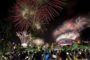 a crowd of people watching fireworks at night at 'Two of a Kind' Heritage Stay with Harbour Views in Sydney