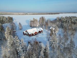 an aerial view of a house covered in snow at Arcticmint in Rovaniemi