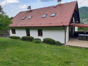 a white house with a red roof at MARLEN in Ústí nad Labem