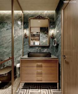 uma casa de banho com um lavatório e um espelho em La Passion Premium Cau Go em Hanói