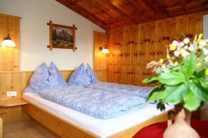 Postel nebo postele na pokoji v ubytování Haus Harmonika