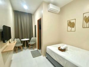 TV a/nebo společenská místnost v ubytování Torres Traveller's Inn