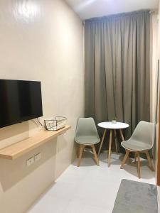TV a/nebo společenská místnost v ubytování Torres Traveller's Inn