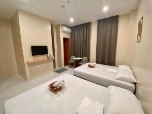 TV a/nebo společenská místnost v ubytování Torres Traveller's Inn