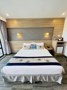 Tempat tidur dalam kamar di Kaani Grand Seaview