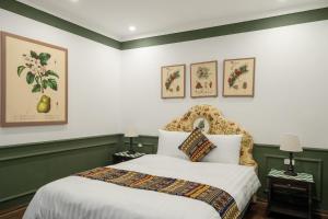 Postel nebo postele na pokoji v ubytování The Gate Boutique Hotel Sapa