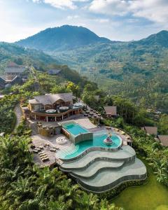 an aerial view of a house with a swimming pool at Elevate Bali in Munduk