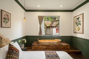 Postel nebo postele na pokoji v ubytování The Gate Boutique Hotel Sapa