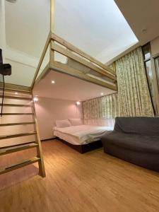 a bedroom with a bunk bed and a ladder at Dream Travel in Taipei