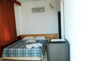 Ένα ή περισσότερα κρεβάτια σε δωμάτιο στο Kleopatra Beach Yildiz Hotel