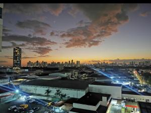 a view of a city at night with at Apartment in the City in Panama City