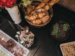 a table topped with lots of different types of food at VAYA Pfunds in Pfunds