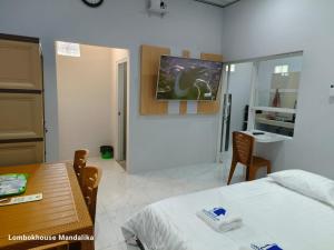 Lombokhouse Mandalika客房内的一张或多张床位