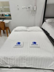 Lombokhouse Mandalika客房内的一张或多张床位