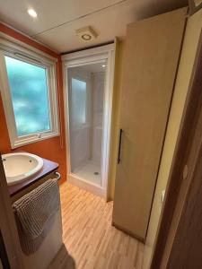 a bathroom with a sink and a window at Mobil Duss in Bollène