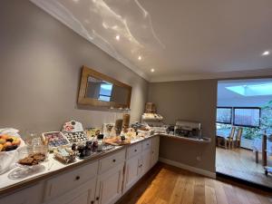 a kitchen with a counter with food on it at Maison LUTETIA R in Strasbourg