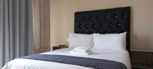 Postel nebo postele na pokoji v ubytování Smart B&B in Turfloop Mankweng