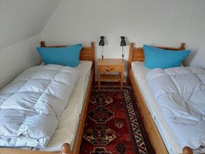 Postel nebo postele na pokoji v ubytování Falkenweg 7