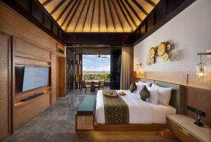 Sumitra Luxury Villas & Resort by Pramana客房内的一张或多张床位