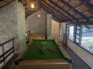 a room with a pool table in a building at Avadale Munnar (Stag Groups Not Allowed) in Chinnakanal