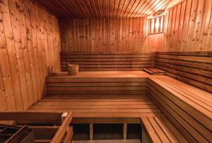 an empty sauna with wooden walls and ceilings at Boutique Hotel Bristol in Košice