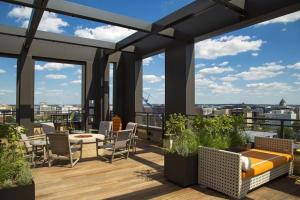 a rooftop patio with a view of the city at Mount Vernon 1BR w Gym Pool nr NoMa Metro WDC-204 in Washington, D.C.