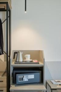 a box with a microwave on top at RMH Modena Raffaello in Modena